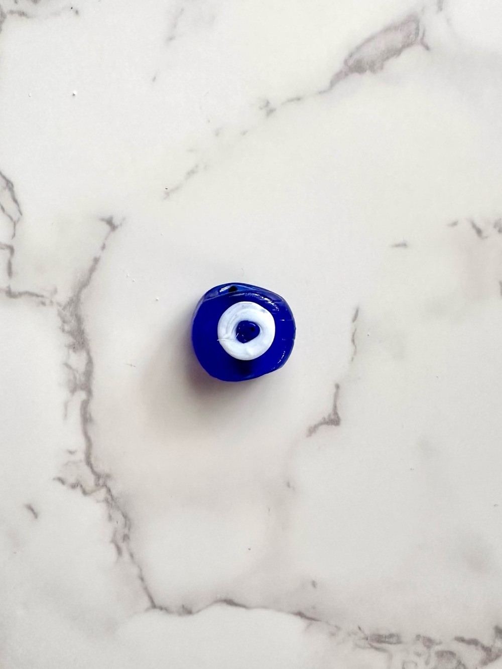 Turkish Evil Eye Bead · Blue and White Amulet made of Molten Glass